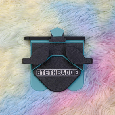 Black and Teal-colored Stethoscope Holder or Nurse tool or Nurse accessory for nurses called Stethbadge.