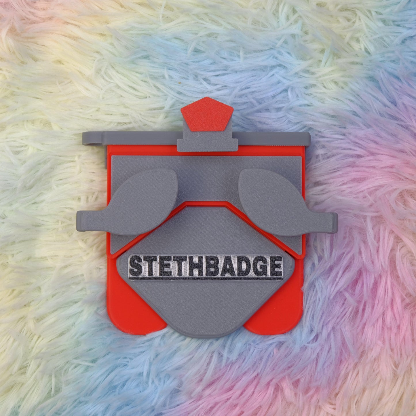 Grey and Pop Red-colored Stethoscope Holder or Nurse tool or Nurse accessory for nurses called Stethbadge.