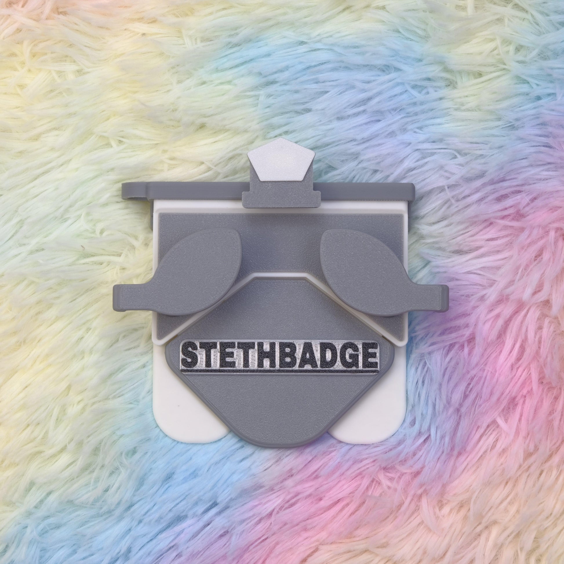 Grey and White-colored Stethoscope Holder or Nurse tool or Nurse accessory for nurses called Stethbadge.