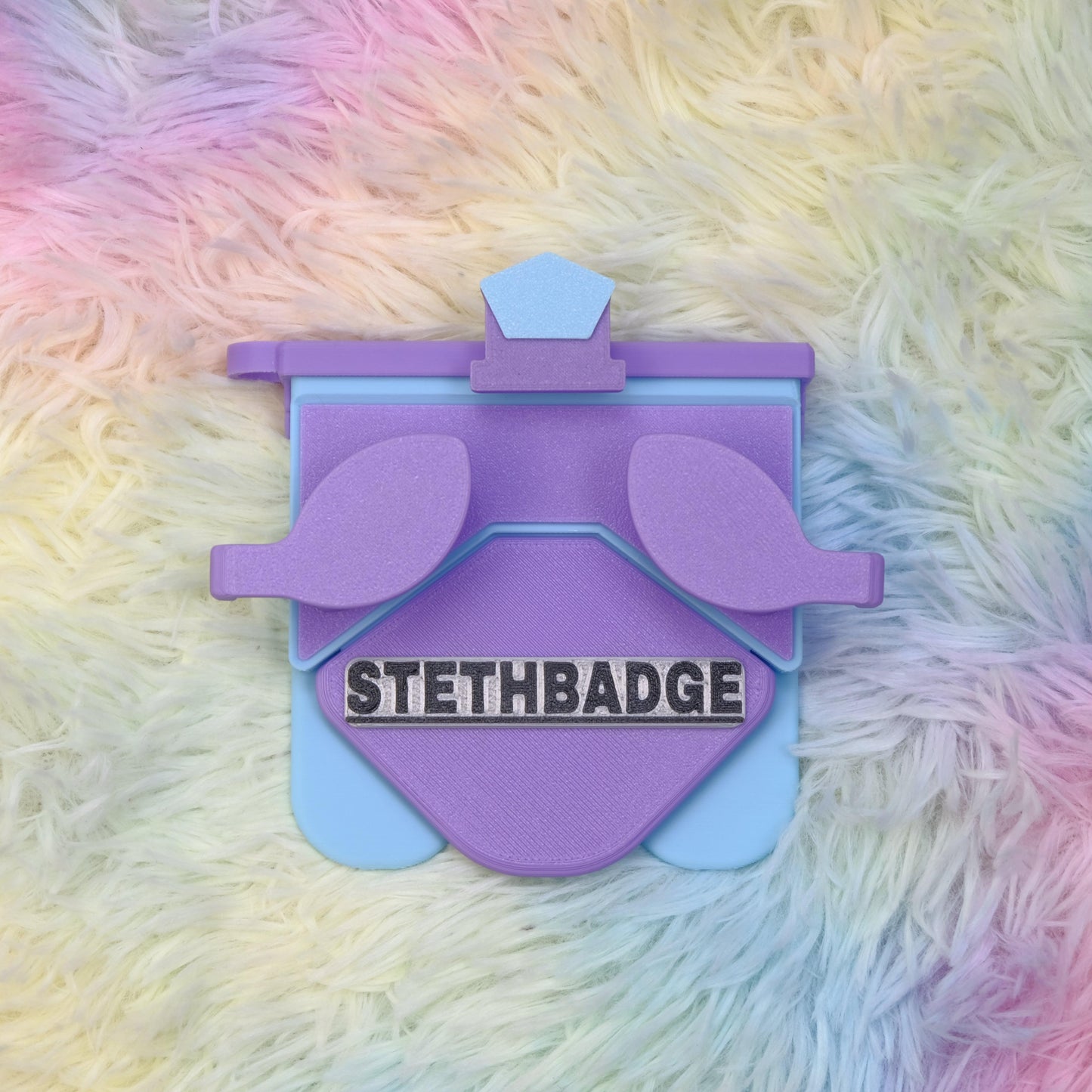 A Purple-Lavender-Sky-Blue-colored  Stethoscope Holder or Nurse tool or Nurse accessory for nurses called Stethbadge.
