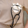 White-colored Stethoscope Holder or Nurse tool or Nurse accessory for nurses called Stethbadge.