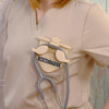 Beige-colored Stethoscope Holder or Nurse tool or Nurse accessory for nurses called Stethbadge.