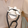 White-colored Stethoscope Holder or Nurse tool or Nurse accessory for nurses called Stethbadge.