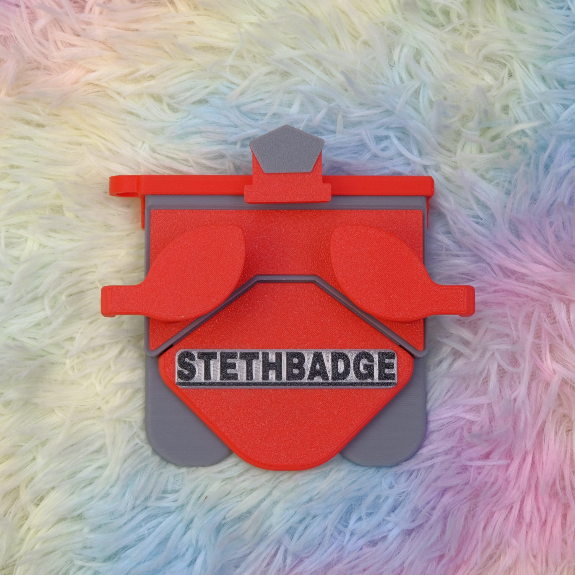 Red and Grey-colored Stethoscope Holder or Nurse tool or Nurse accessory for nurses called Stethbadge.