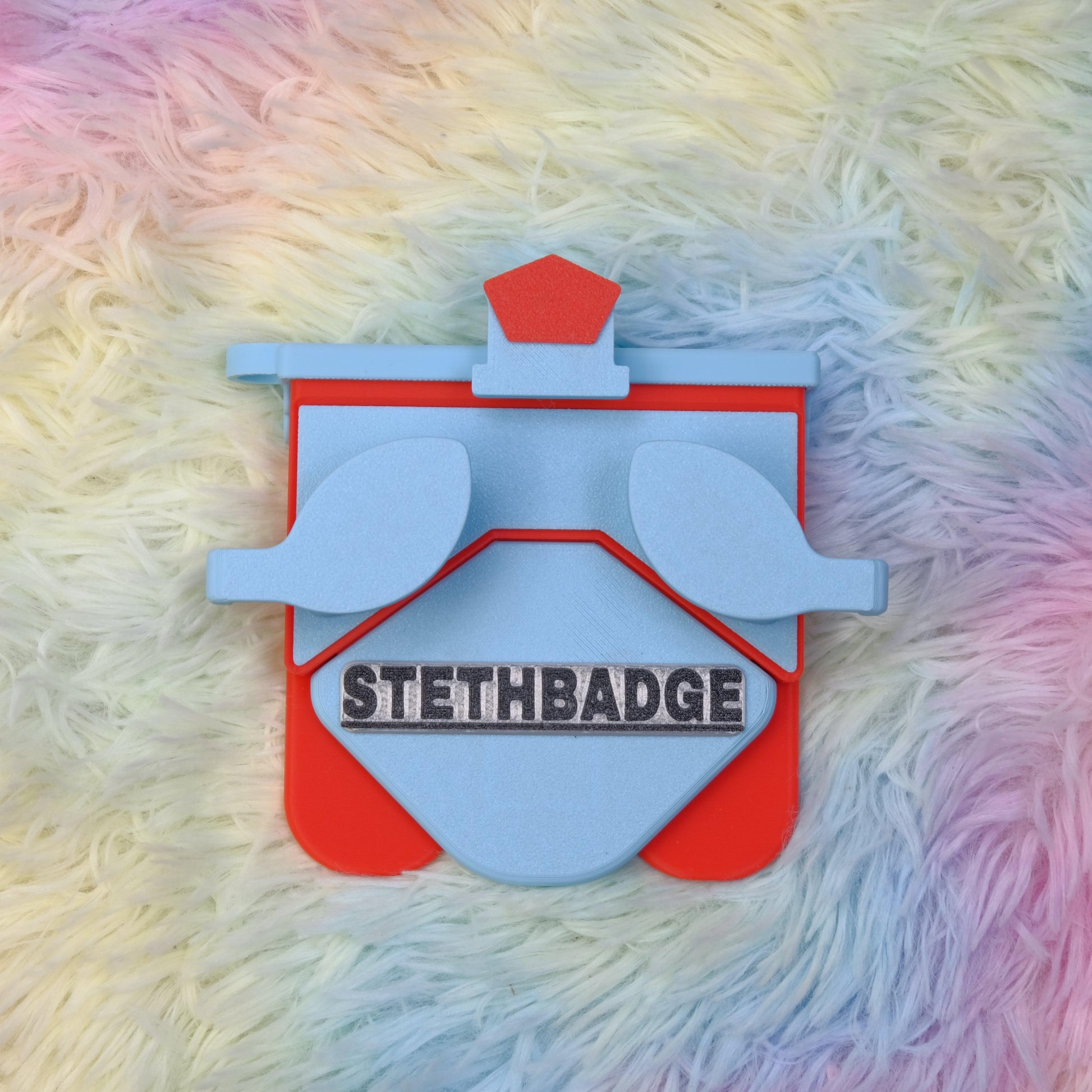 Sky Blue and Pop Red-colored Stethoscope Holder or Nurse tool or Nurse accessory for nurses called Stethbadge.