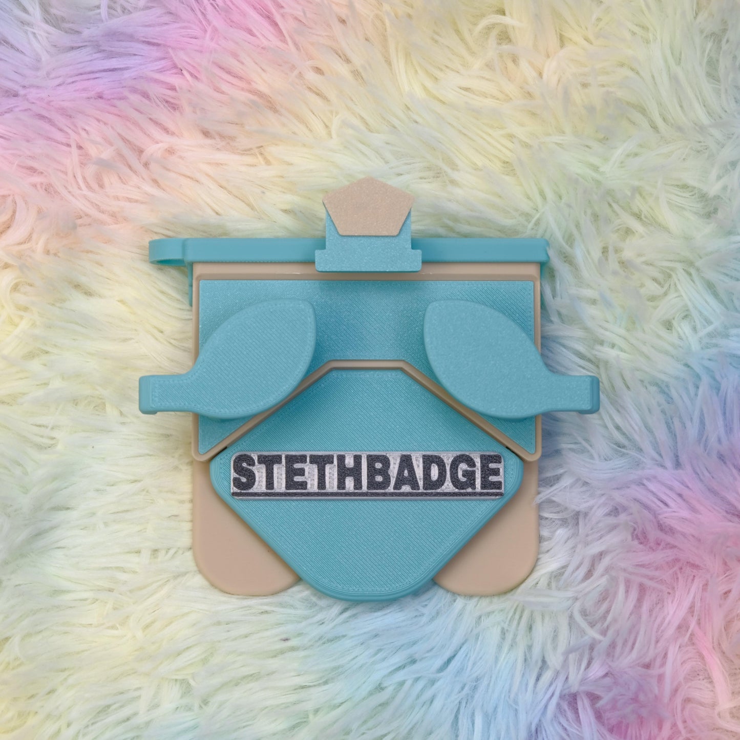 Teal Green and Beige-colored Stethoscope Holder or Nurse tool or Nurse accessory for nurses called Stethbadge.