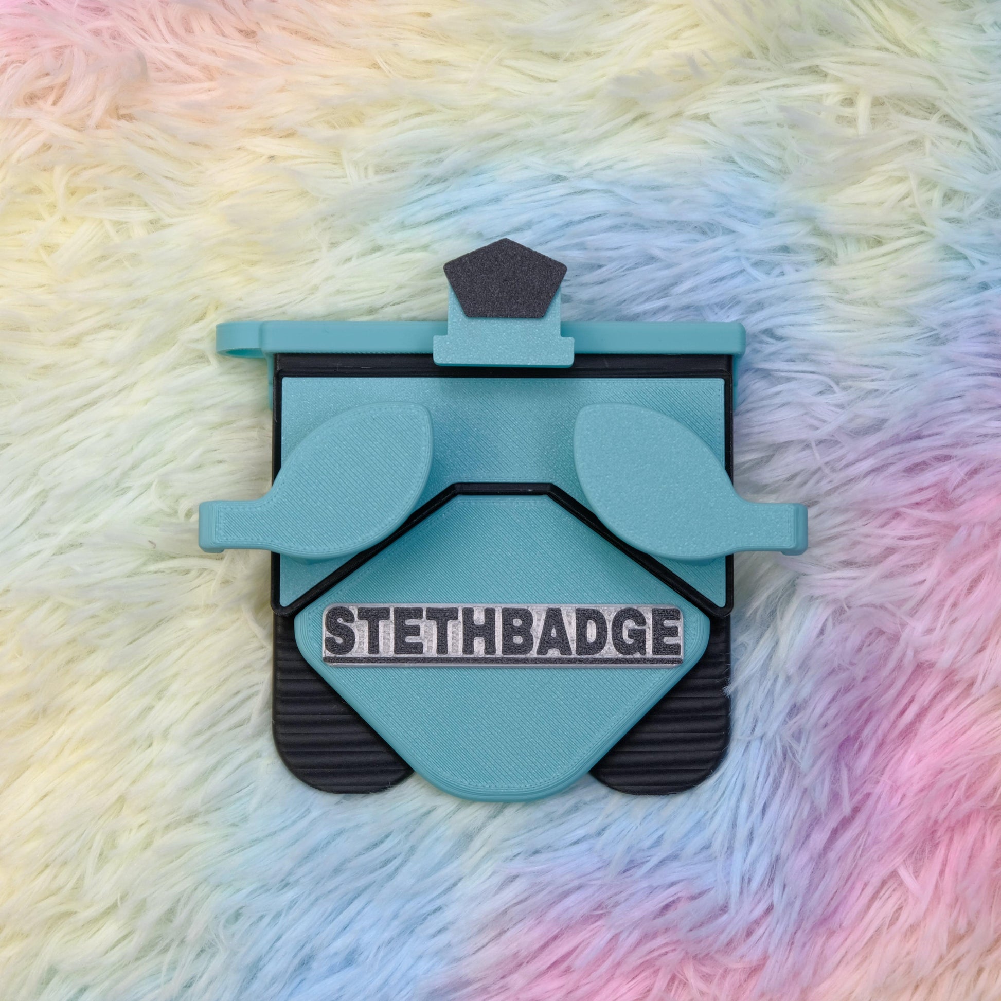 Teal and Black-colored Stethoscope Holder or Nurse tool or Nurse accessory for nurses called Stethbadge.