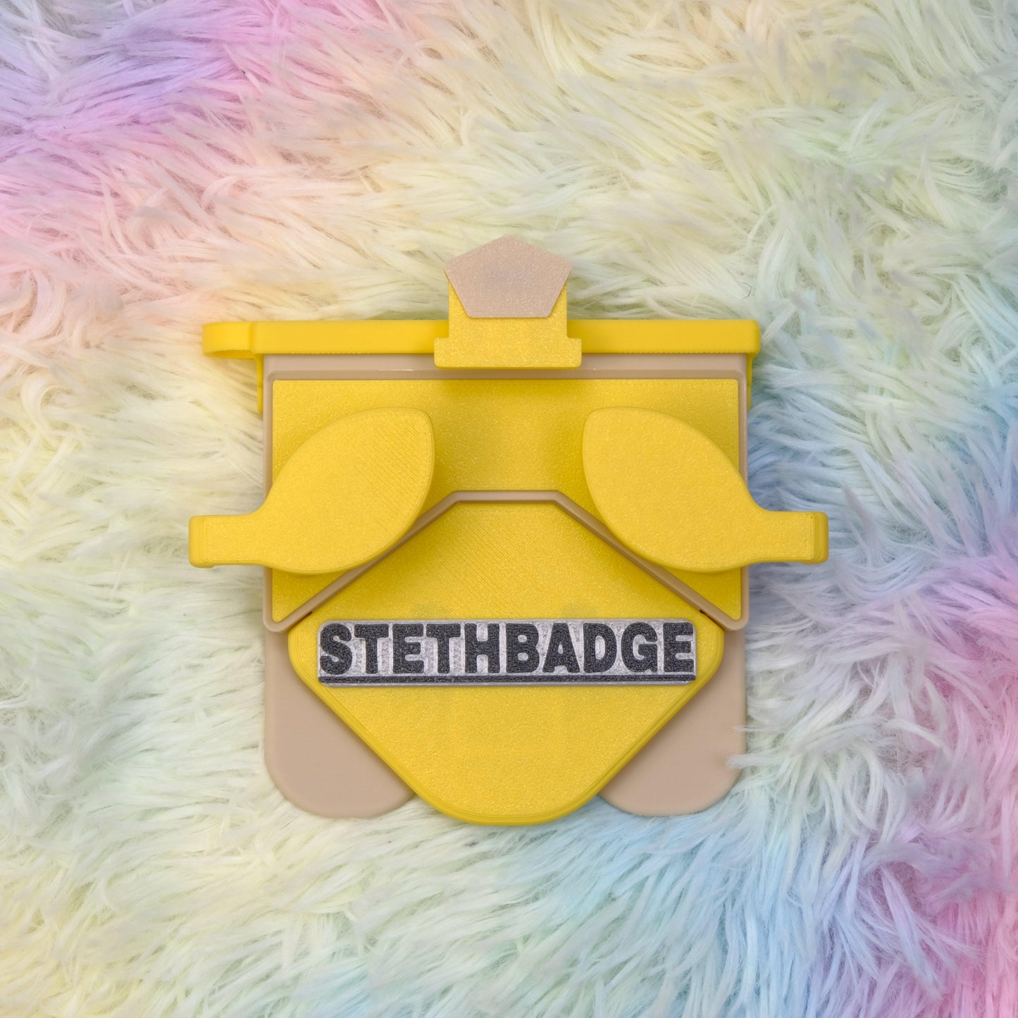 Yellow and Beige-colored Stethoscope Holder or Nurse tool or Nurse accessory for nurses called Stethbadge.