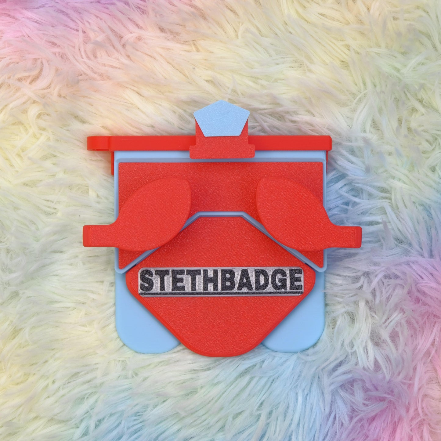Red and Sky Blue-colored Stethoscope Holder or Nurse tool or Nurse accessory for nurses called Stethbadge.
